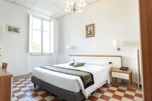 Voodi või voodid majutusasutuse Hotel St. James toas