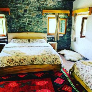 Postel nebo postele na pokoji v ubytování Shpella Guesthouse Theth