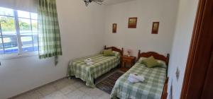 Postel nebo postele na pokoji v ubytování Vivienda Vacacional Lulu Tijarafe