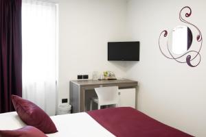 Voodi või voodid majutusasutuse Hotel Corte Del Paggio toas