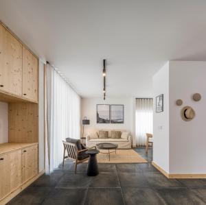 a living room with a couch and a table at Ericeira Prime Villas in Ericeira