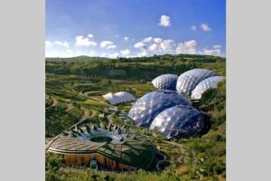 a group of domes of greenhouses in a field at Large House in Looe, Near Beach and Bars with Great Views, Free Parking and Free Access to a Nearby Indoor Swimming Pool in Looe