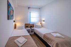 Postel nebo postele na pokoji v ubytování PINNA RESIDENCE - SV. JEROLIM