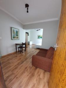 a living room with a couch and a table at Colinas Hotel in Machado