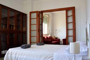 Postel nebo postele na pokoji v ubytování Mare di Roma