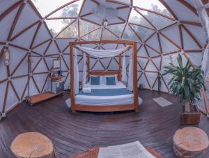 Letto o letti in una camera di Domus Glamping Guatapé