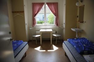 Postel nebo postele na pokoji v ubytování STF Vandrarhem Backåkra