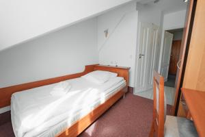 Posteľ alebo postele v izbe v ubytovaní Elita Hotel & Restauracja