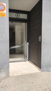 an entrance to a building with a glass door at BioHomeValencia in Valencia