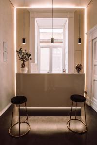 two stools in a room with a window at Nova Relais in Naples