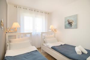 Postel nebo postele na pokoji v ubytování Aurea Novigrad + 26 fotografií