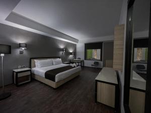 Postel nebo postele na pokoji v ubytování Fato Hotel
