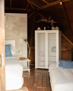 Postel nebo postele na pokoji v ubytování Tava Glamping Lago + 14 fotografií