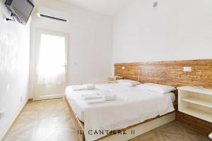Postel nebo postele na pokoji v ubytování Il Cantiere - Casa Di Una Volta.