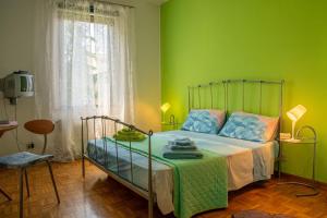 Ein Bett oder Betten in einem Zimmer der Unterkunft Le Ortensie di Via Rossetti