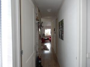 a hallway of a home with white walls at Het Speijerhuis in Harlingen