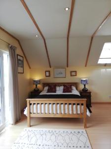 a bedroom with a large bed in a room at The Garden Room at Dartmouth in Dartmouth