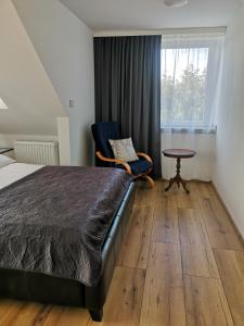 Posteľ alebo postele v izbe v ubytovaní Apartamenty Lawendowy Zakątek 7 + 16 fotografií