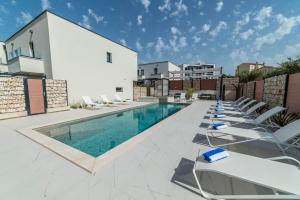 Bazén v ubytovaní PINNA RESIDENCE - PINNA alebo v jeho blízkosti