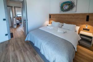 Posteľ alebo postele v izbe v ubytovaní PINNA RESIDENCE - PINNA