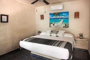 Postel nebo postele na pokoji v ubytování Hotel Macondo Holbox