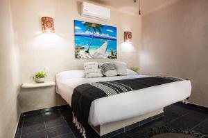 Postel nebo postele na pokoji v ubytování Hotel Macondo Holbox