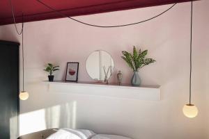 En eller flere senge i et værelse på Etern Stays - Bohemian Apartment