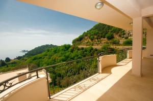 a balcony with a view of the ocean at St.George Apartments in Petrovac na Moru