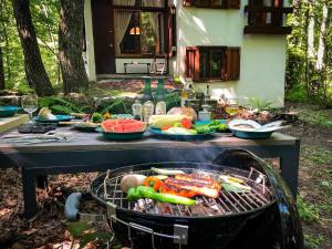 a picnic table with a grill with food on it at Agatsuma-gun - House - Vacation STAY 11437 in Kita-karuizawa