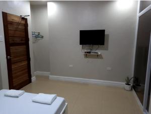 TV a/nebo společenská místnost v ubytování Sandscape Hotel