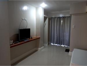 TV a/nebo společenská místnost v ubytování Sandscape Hotel