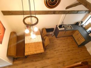 an overhead view of a dining room with a table at Vakantieverblijf Perron 3 in Haarle +3 photos