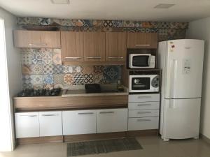 Η κουζίνα ή μικρή κουζίνα στο Residencial Itapeva Sul