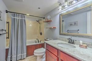 a bathroom with a sink and a toilet and a tub at Waterfall/6th‑Floor View/Walk Downtown in Gatlinburg