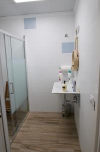 a bathroom with a sink and a shower at Lux Valentia Olta Calpe in Calpe