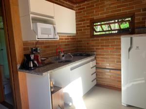 A cozinha ou cozinha compacta de Cactus Chalés & Cabanas em lumiar