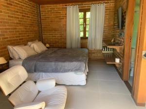 Cama ou camas em um quarto em Cactus Chalés & Cabanas em lumiar
