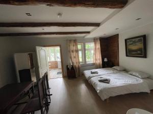 a bedroom with a large bed in a room at Haapsalu Guesthouse in Haapsalu