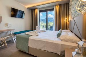 Postel nebo postele na pokoji v ubytování VERANO LUXURY STUDIOS