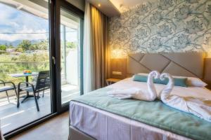 Postel nebo postele na pokoji v ubytování VERANO LUXURY STUDIOS