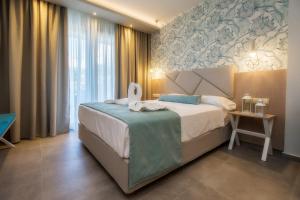 Postel nebo postele na pokoji v ubytování VERANO LUXURY STUDIOS