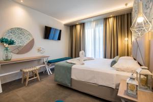 Postel nebo postele na pokoji v ubytování VERANO LUXURY STUDIOS