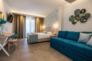 Postel nebo postele na pokoji v ubytování VERANO LUXURY STUDIOS