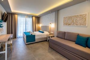 Postel nebo postele na pokoji v ubytování VERANO LUXURY STUDIOS