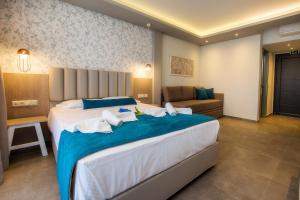 Postel nebo postele na pokoji v ubytování VERANO LUXURY STUDIOS