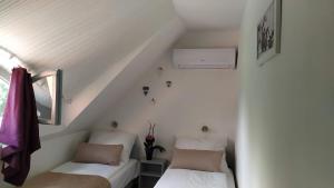 Postel nebo postele na pokoji v ubytování Arcadia Guesthouse