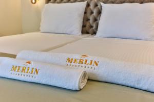 Postel nebo postele na pokoji v ubytování APARTMENTS MERLIN
