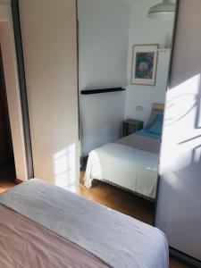 Posteľ alebo postele v izbe v ubytovaní Apartamento The Wall Xperience