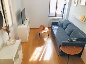 Televízia a/alebo spoločenská miestnosť v ubytovaní Apartamento The Wall Xperience