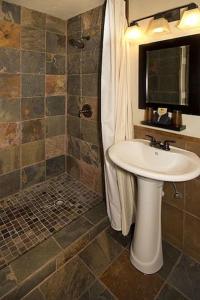 a bathroom with a sink and a shower at Avalon Lodge South Lake Tahoe in South Lake Tahoe